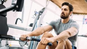 man using a rowing machine