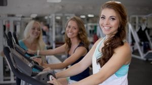 women on exercise equipment